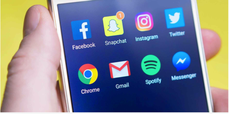 Picture of a phone with social media icons showing