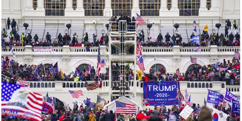 photo of Capitol swarm AP Photo/John Minchillo